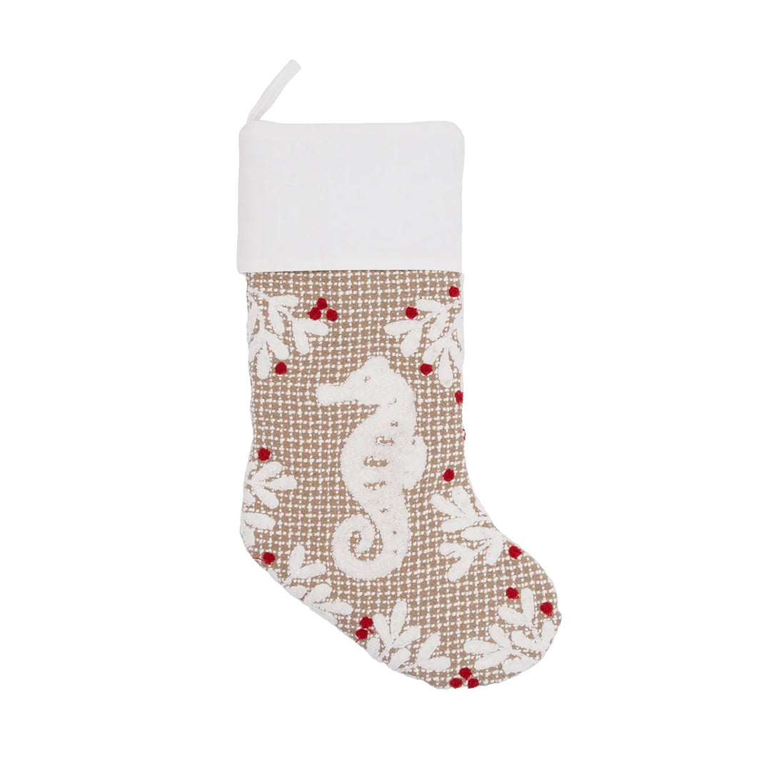 Coastal seahorse Christmas stocking with a white cuff, textured beige fabric, and red berry accents on a white background