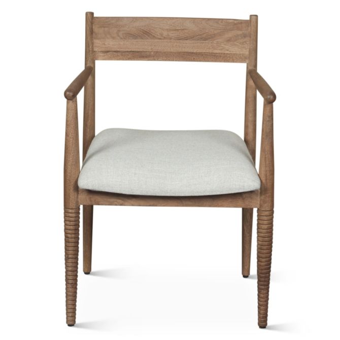Front view of shoreline spindle dining chair with upholstered seat and natural wood frame