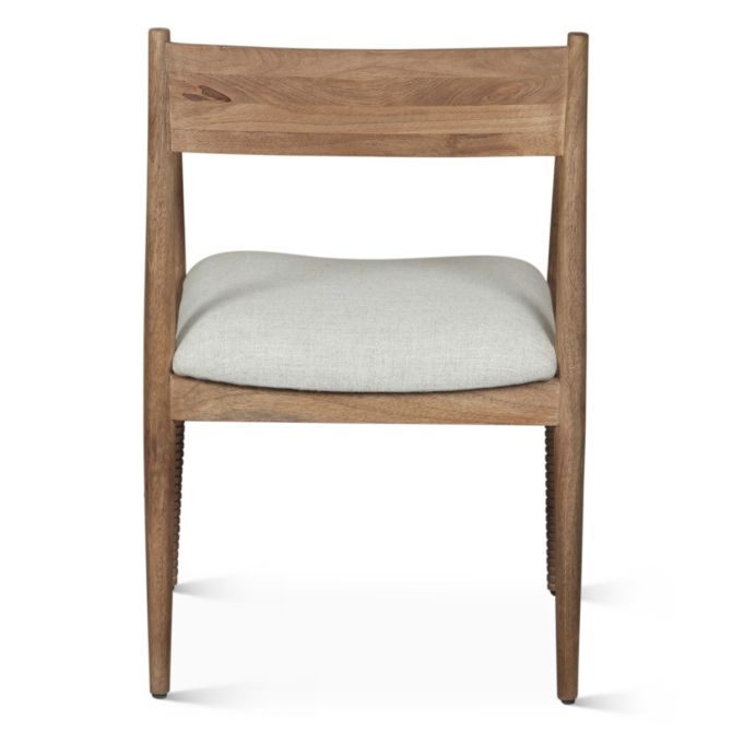 Shoreline upholstered dining chair back view with curved wood frame and neutral linen seat