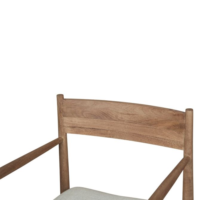 Close-up of wood backrest detail on shoreline spindle dining chair with natural grain finish