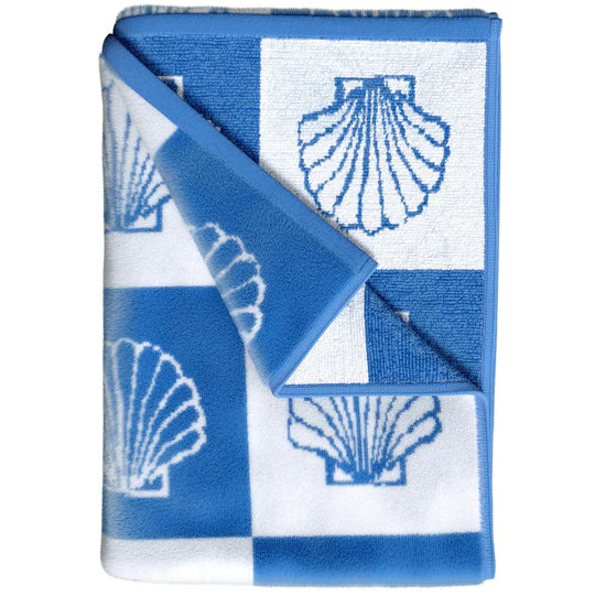 Folded blue checkered seashell beach towel showing soft cotton velour texture
