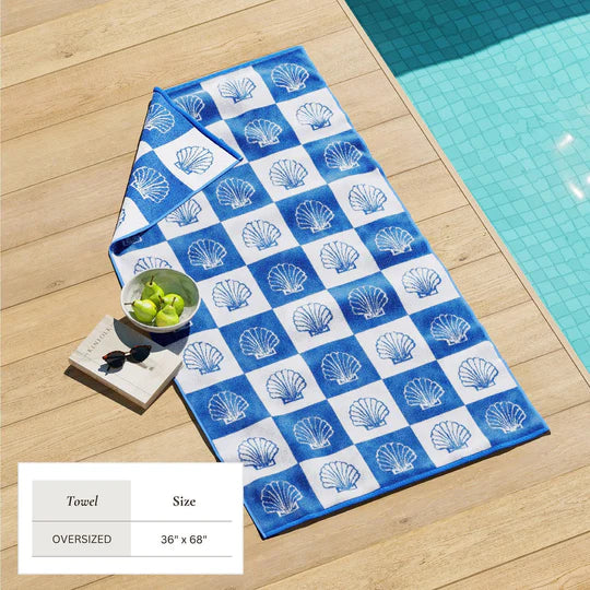 Oversized St. Barts checkered shells beach towel 36x68 displayed poolside