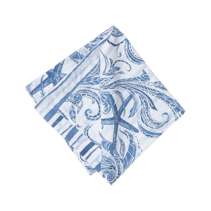 Blue and white patterned cotton napkin on a white background