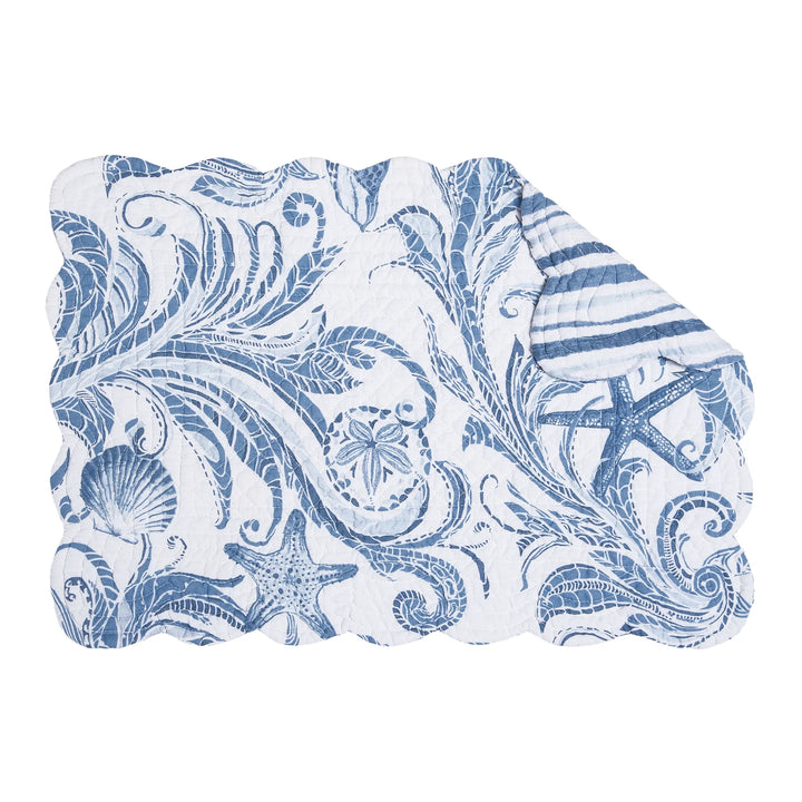 Blue and white coastal patterned palcemat on a white background