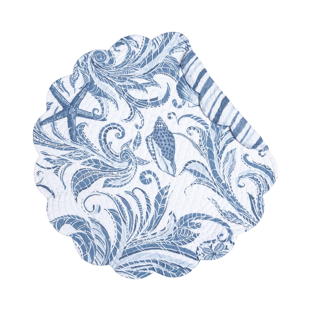 Blue and white coastal patterned round placemat on a white background