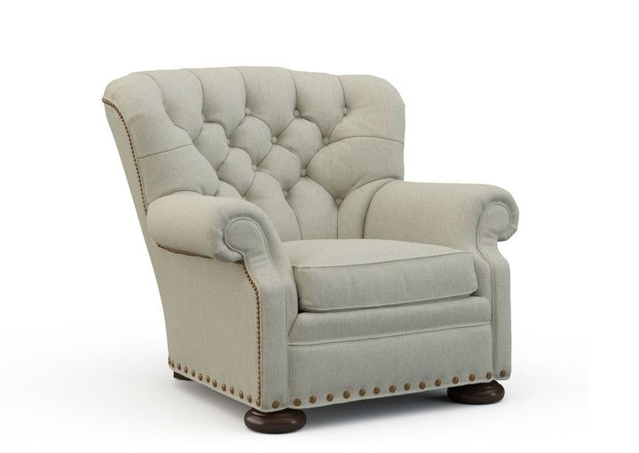 Light gray armchair with tufted backrest on a white background