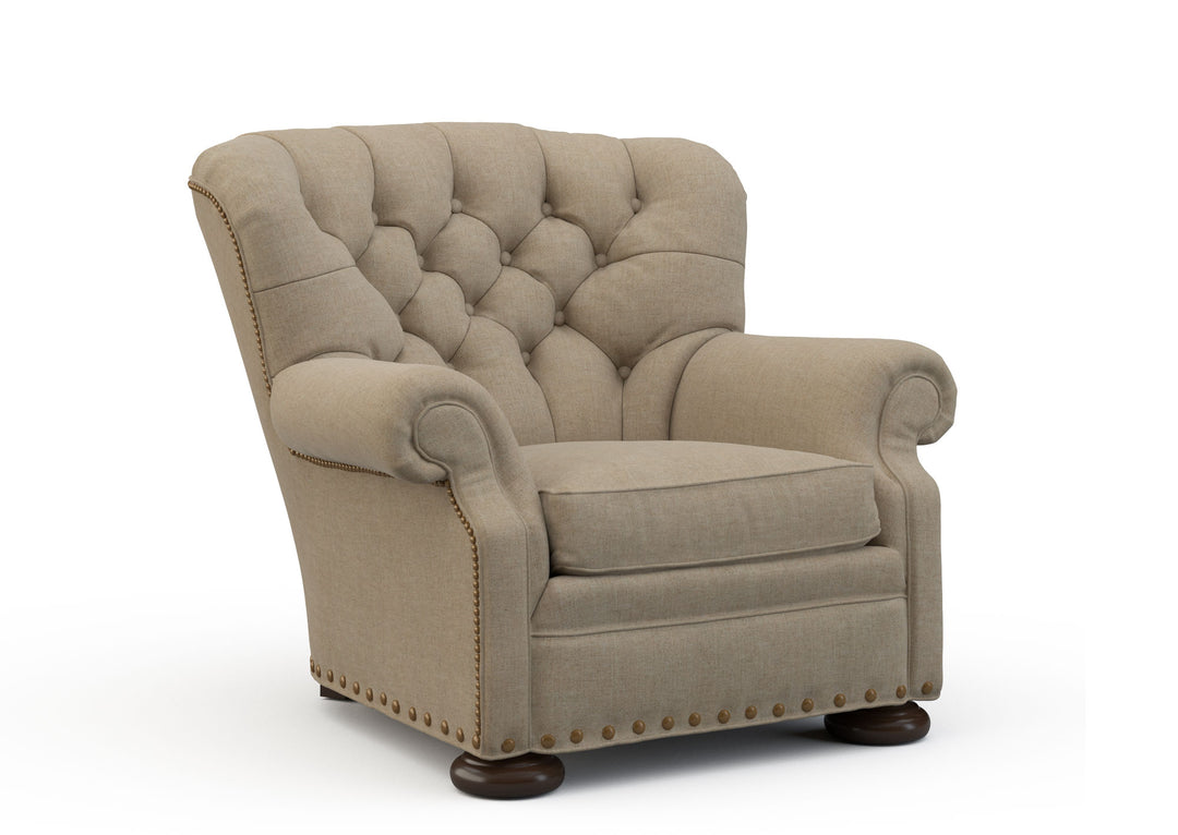Beige armchair with tufted backrest on a white background