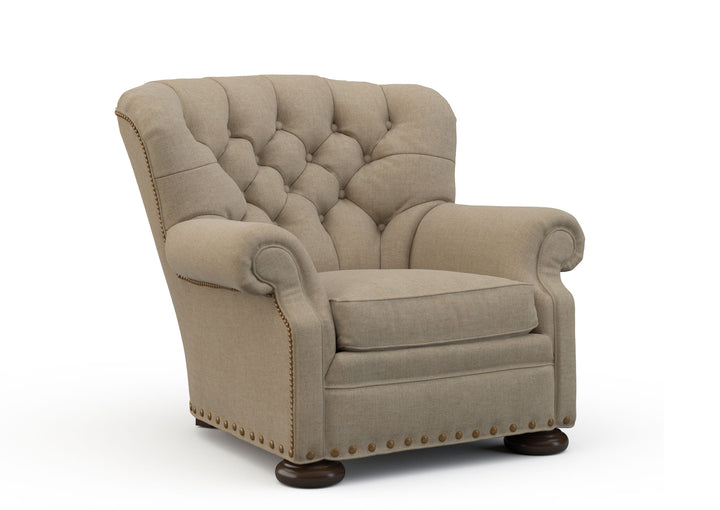 Beige armchair with tufted backrest on a white background