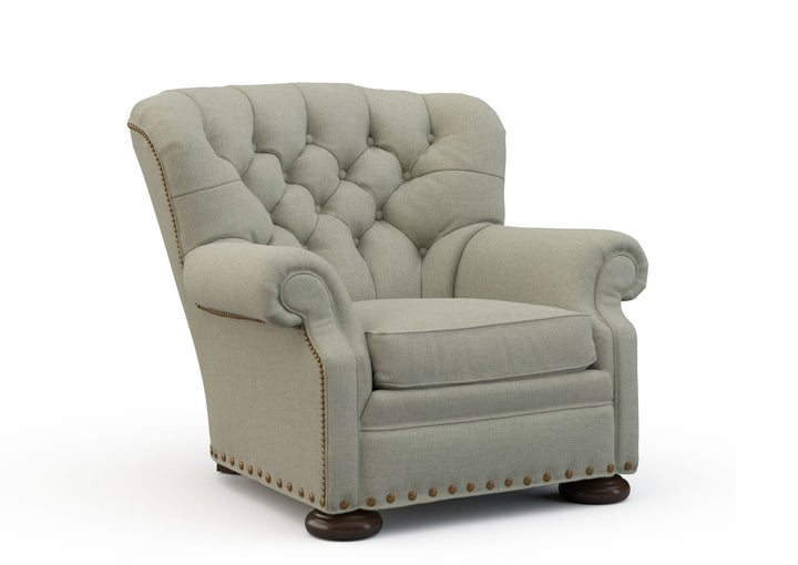 Light gray armchair with tufted backrest on a white background