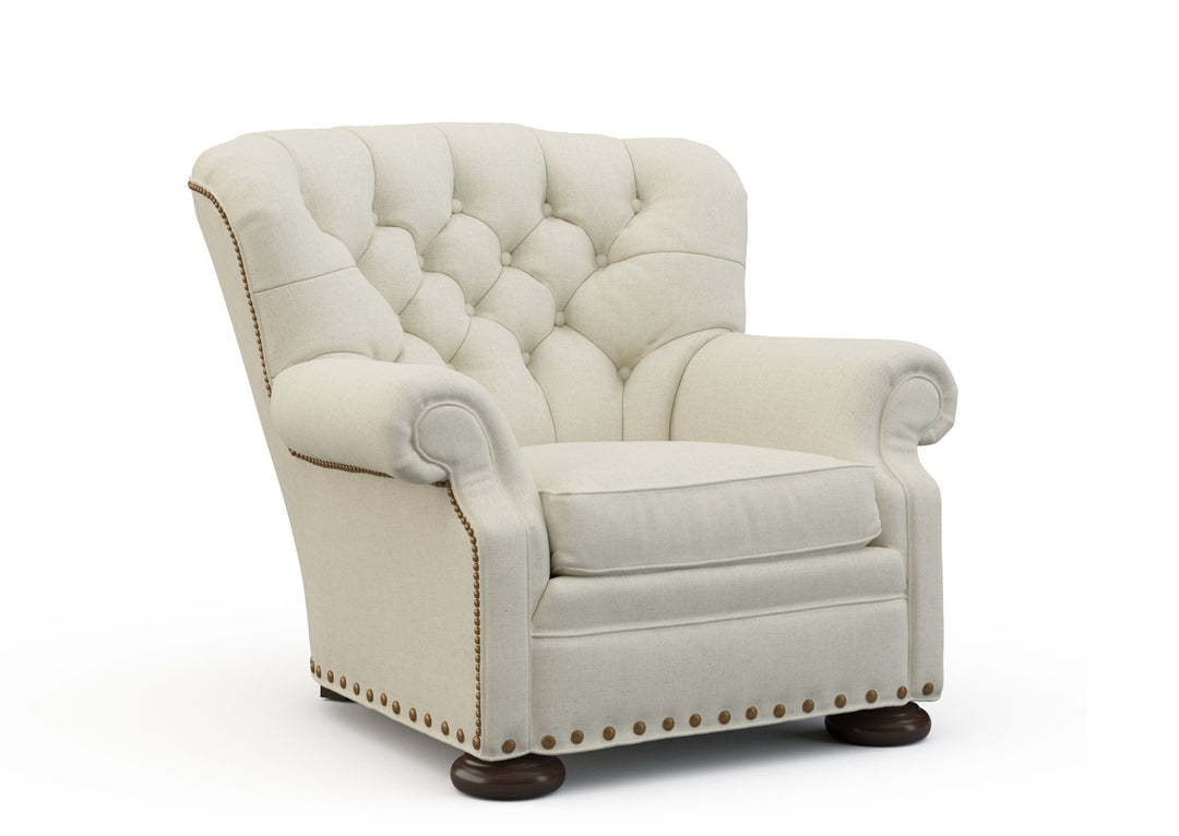 Beige armchair with tufted backrest on a white background. Coastal Compass