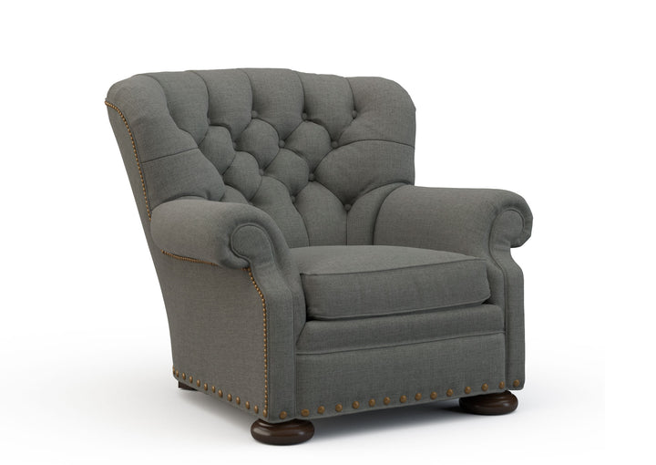 Gray armchair with tufted backrest on a white background