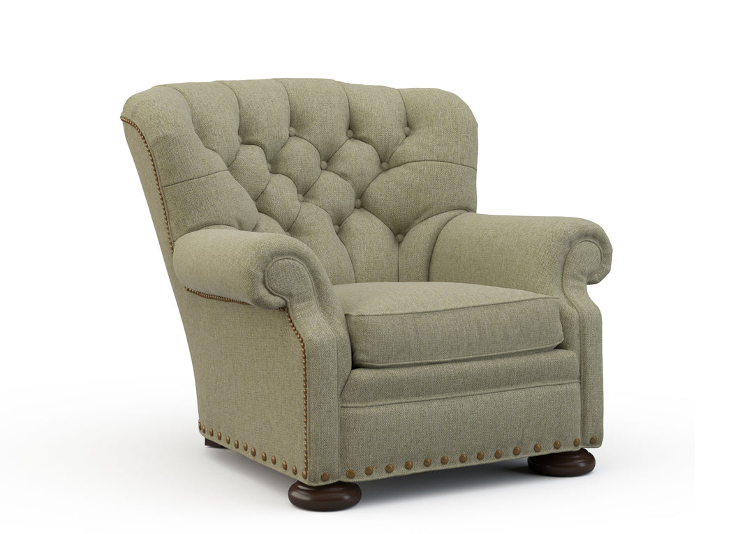 Green armchair with tufted backrest on a white background