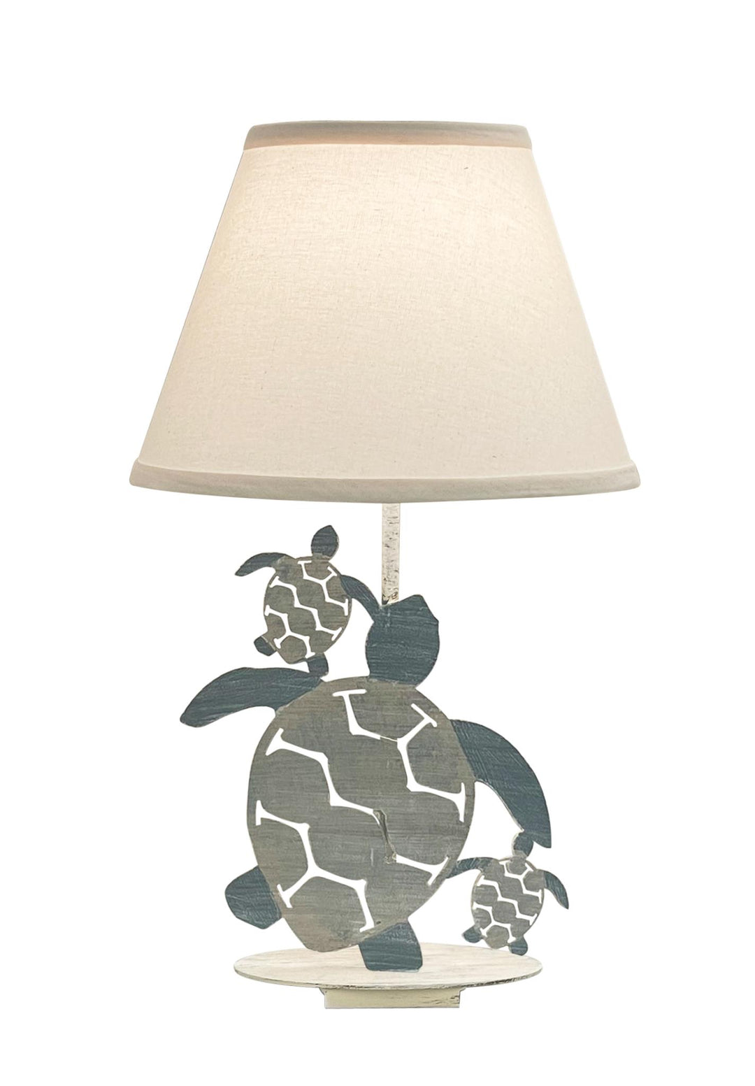 Coastal turtle reef table lamp with neutral fabric shade and layered turtle design
