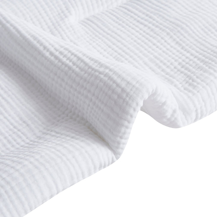 Close-up of voile cotton bedding in white sheer texture