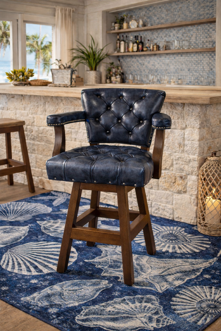 Nautical blue tufted leather swivel bar and counter stool in coastal bar on blue sea shell area rug - American made