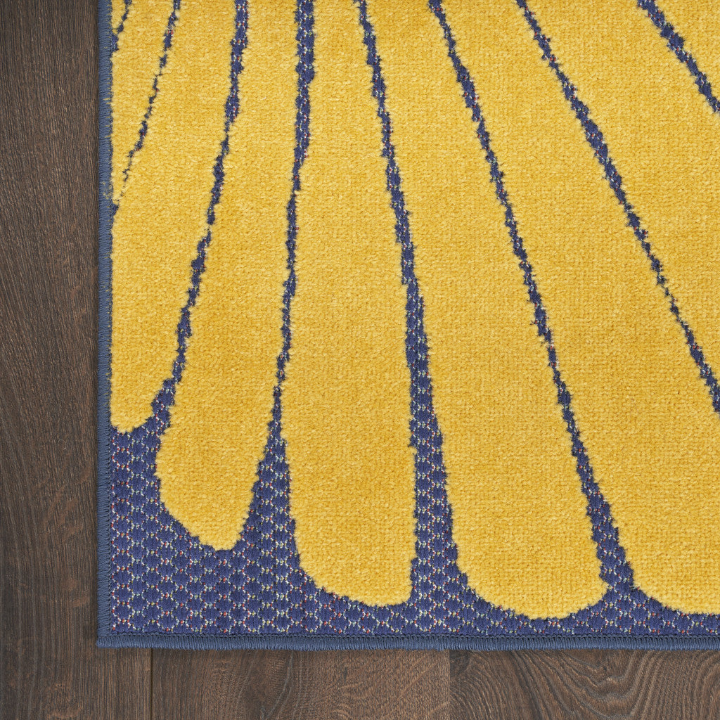 Close up detail of ocean themed rug on hardwood floor 