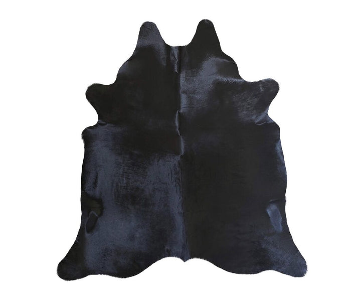 dyed black Brazilian cowhide - The Coastal Compass Home Decor