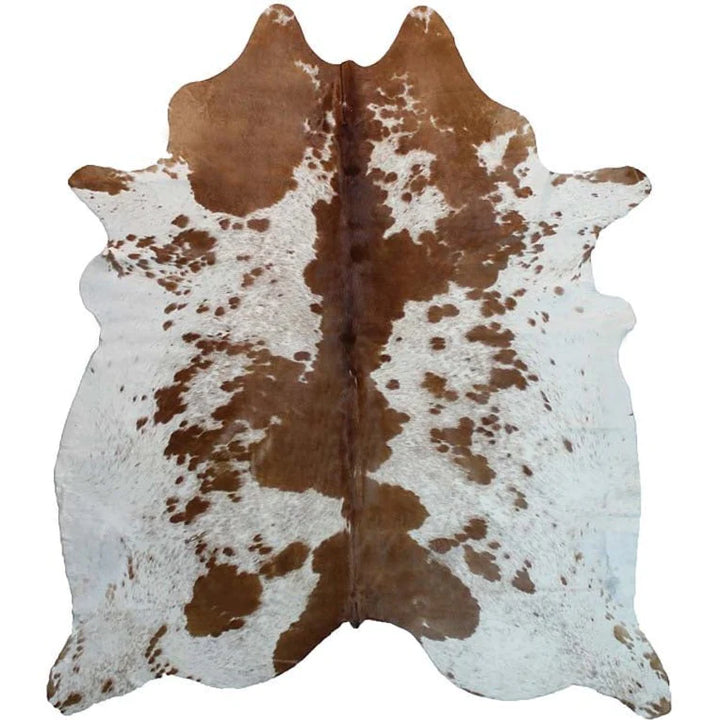 Brown and white Brazilian cowhide - The Coastal Compass Home Decor