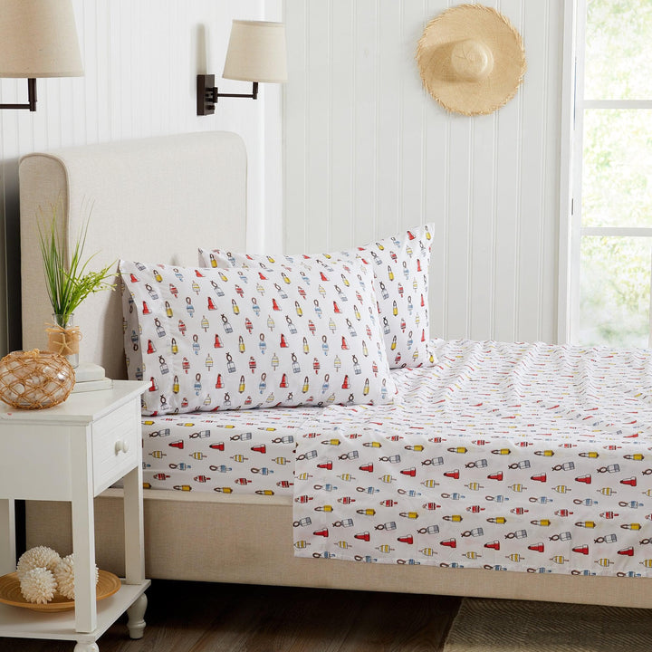 Bed with bouy patterned bedding in a bright bedroom setting