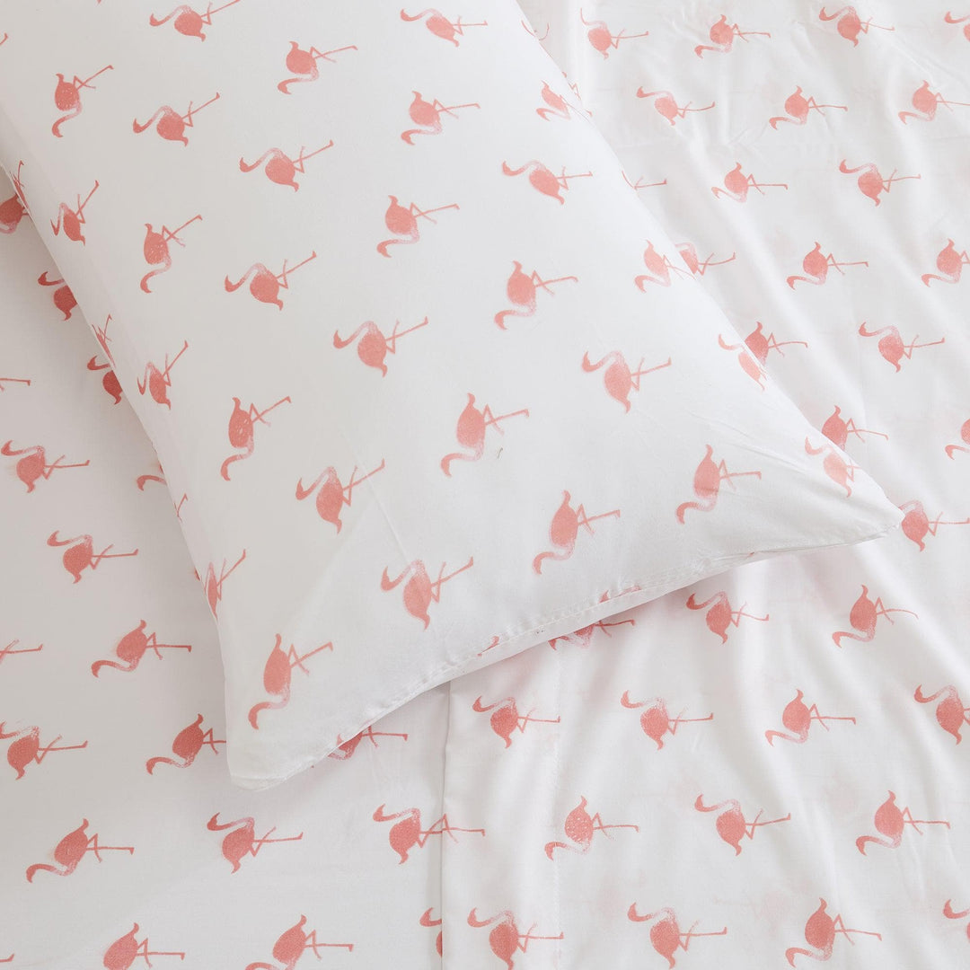 White fabric with pink flamingo pattern