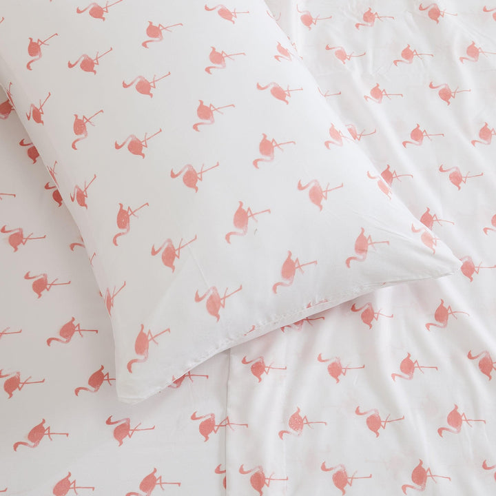 White fabric with pink flamingo pattern