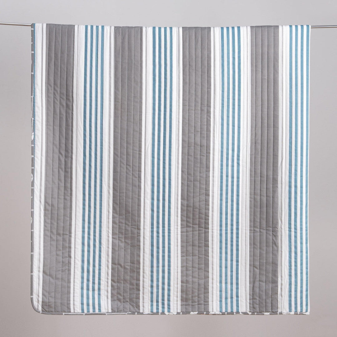 Striped fabric with blue, gray, and white stripes on a gray background