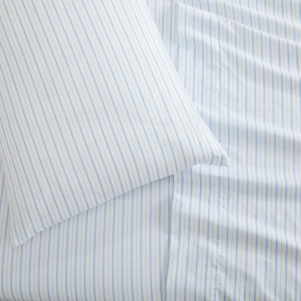 Close-up of light blue and white striped sheets
