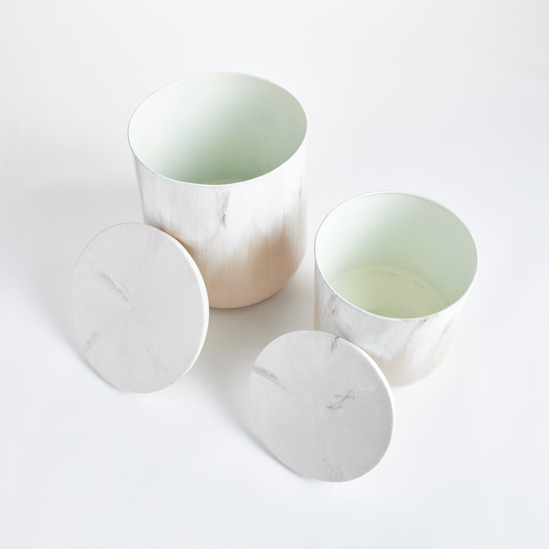 Modern coastal sand drum storage tables in warm neutral tones, sculptural accent tables with hidden storage