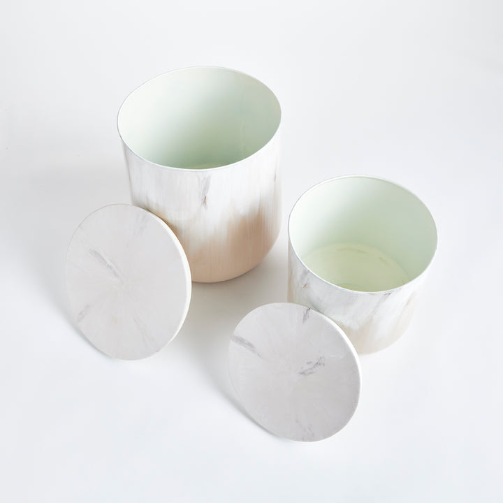 Modern coastal sand drum storage tables in warm neutral tones, sculptural accent tables with hidden storage