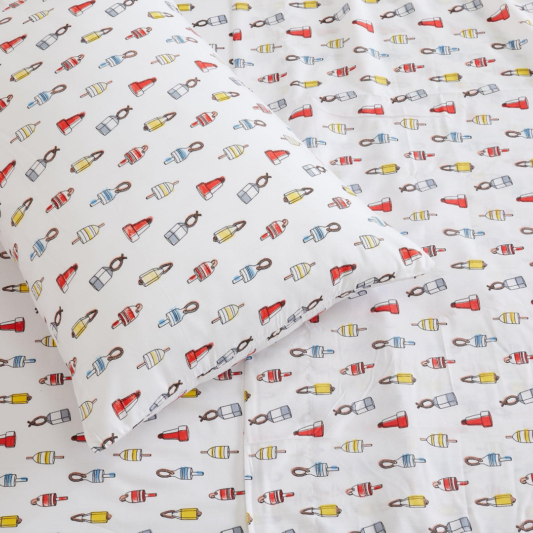 Sheet set with colorful bottle pattern on a white background