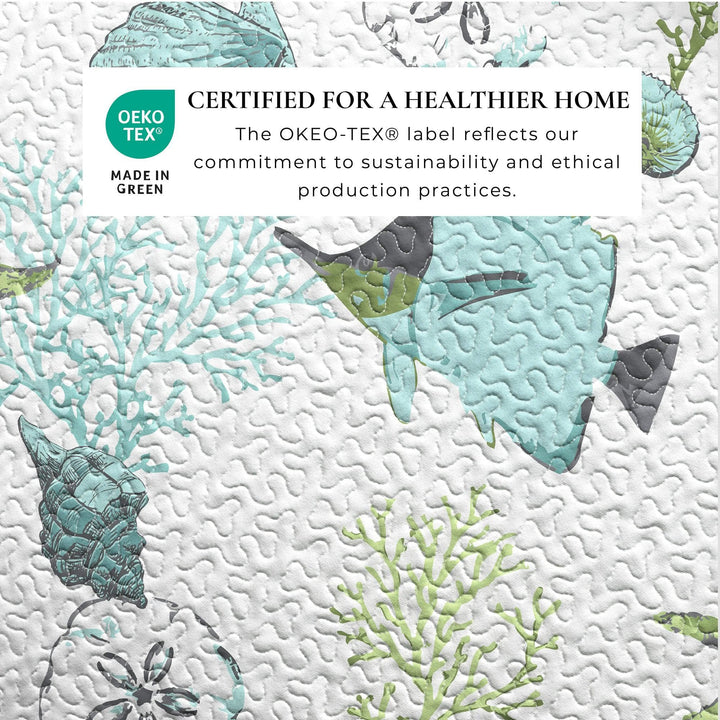 Textured surface with green and gray leaf patterns and Oeko-Tex certification label.