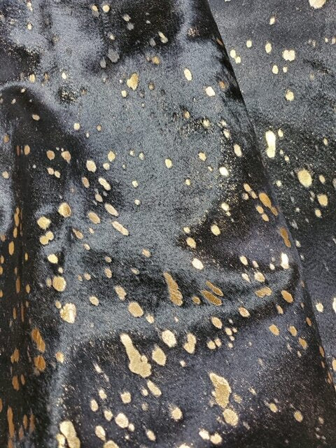 Gold acid wash on black Brazilian cowhide - The Coastal Compass Home Decor