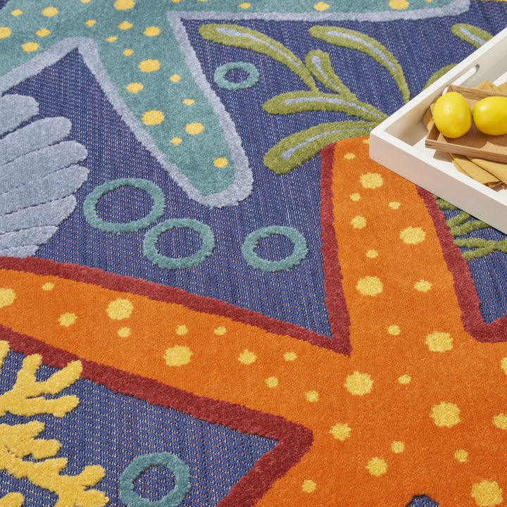 High-low pile texture on indoor outdoor coastal rug in vibrant sea life color