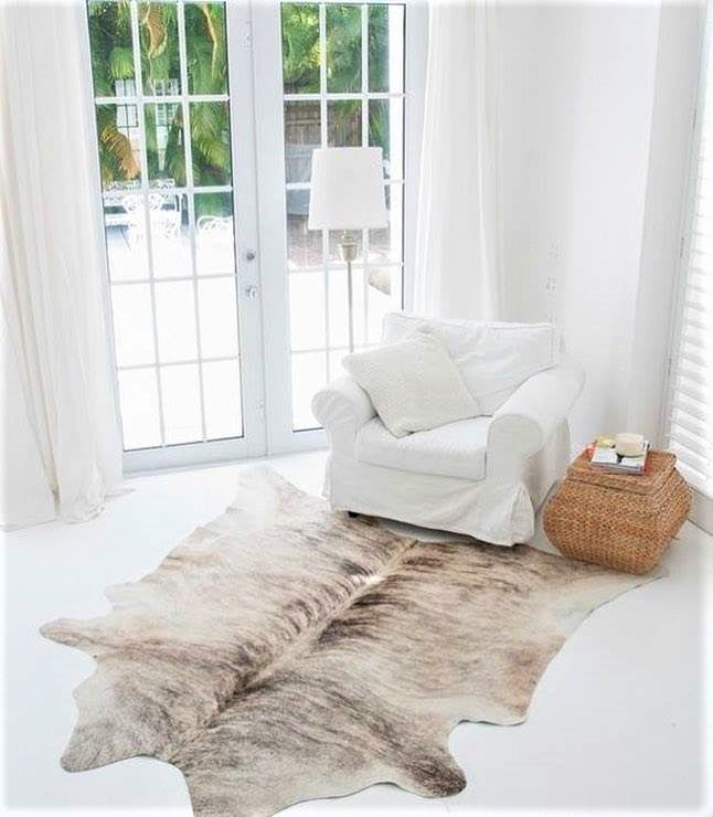 Light Brindle Cowhide Rug in room setting - Coastal Compass Home Decor