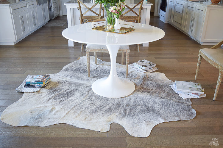 Light Brindle Cowhide Rug in room setting - Coastal Compass Home Decor