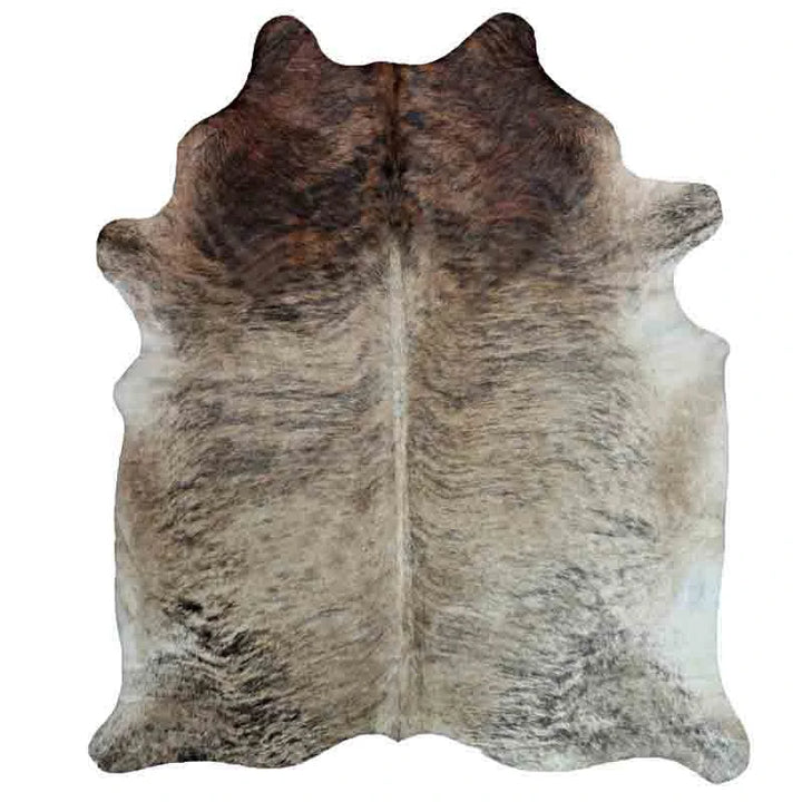 Light Brindle/beige Cowhide Rug in room setting - Coastal Compass Home Decor