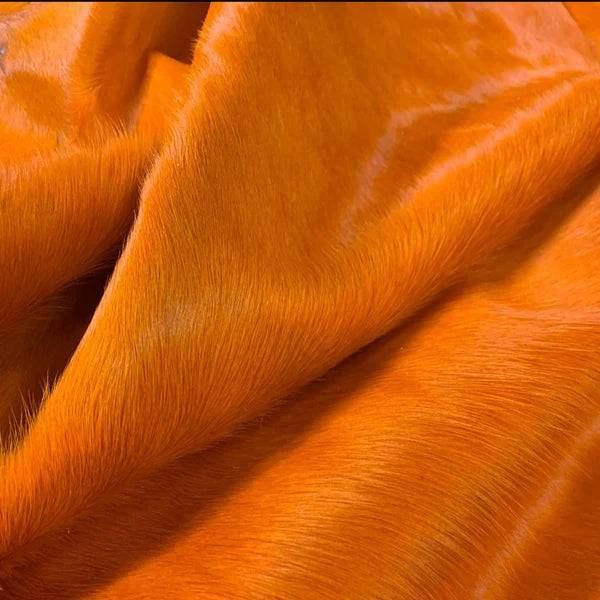 Dyed orange cowhide detail - The Coastal Compass Home Decor