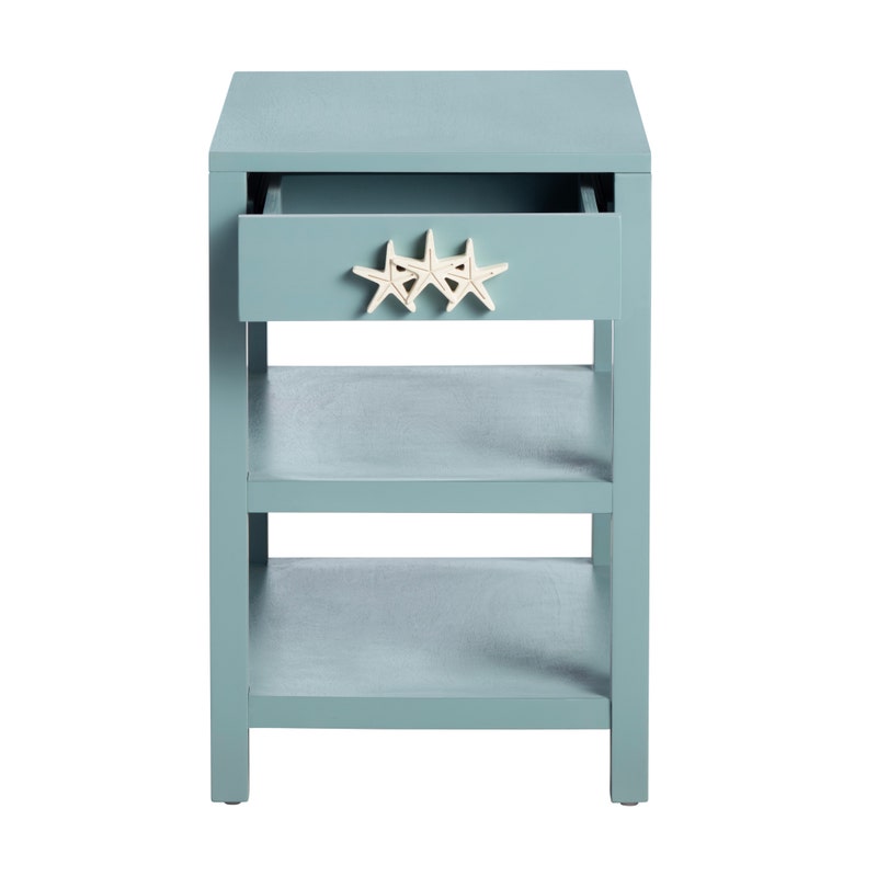 Light blue side table with starfish design on a white background