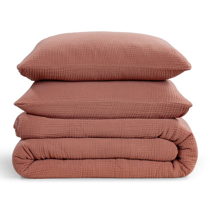 Stack of Voile comforter set with 2 pillows and comforter in Clay