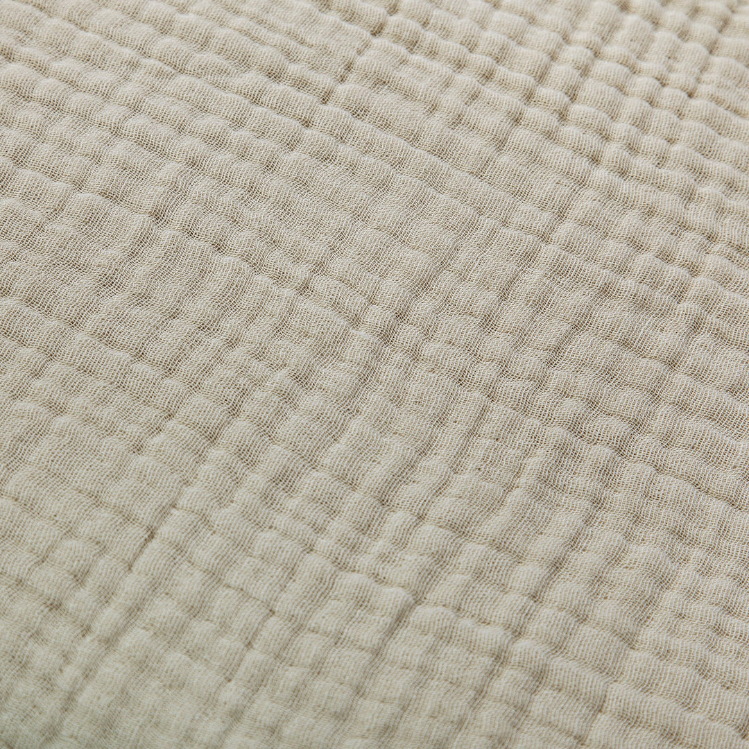 Close up of sable voile cotton bedding with texture