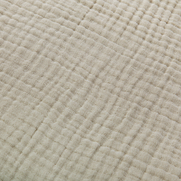 Close up of sable voile cotton bedding with texture