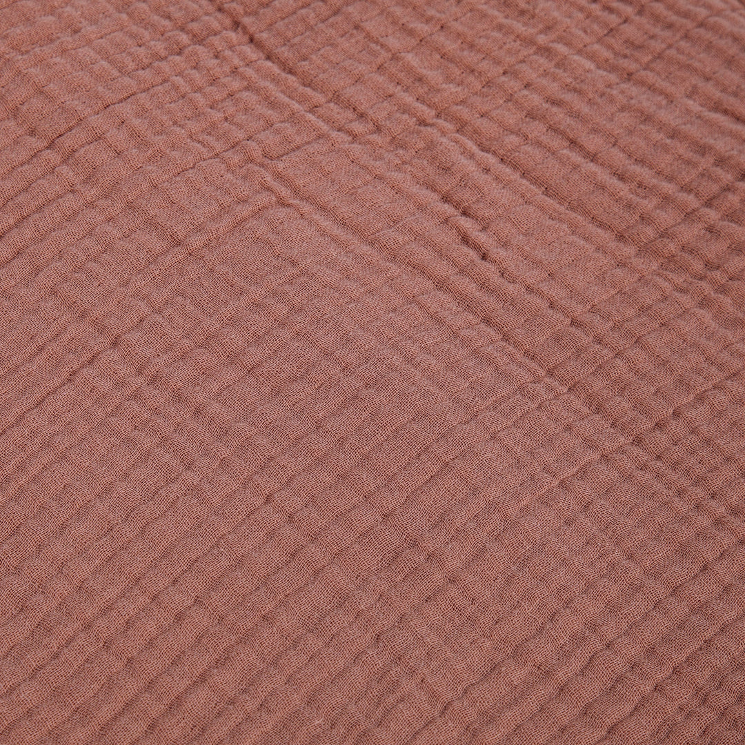Close-up of textured voile cotton clay fabric surface
