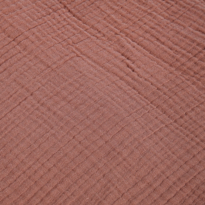 Close-up of textured voile cotton clay fabric surface