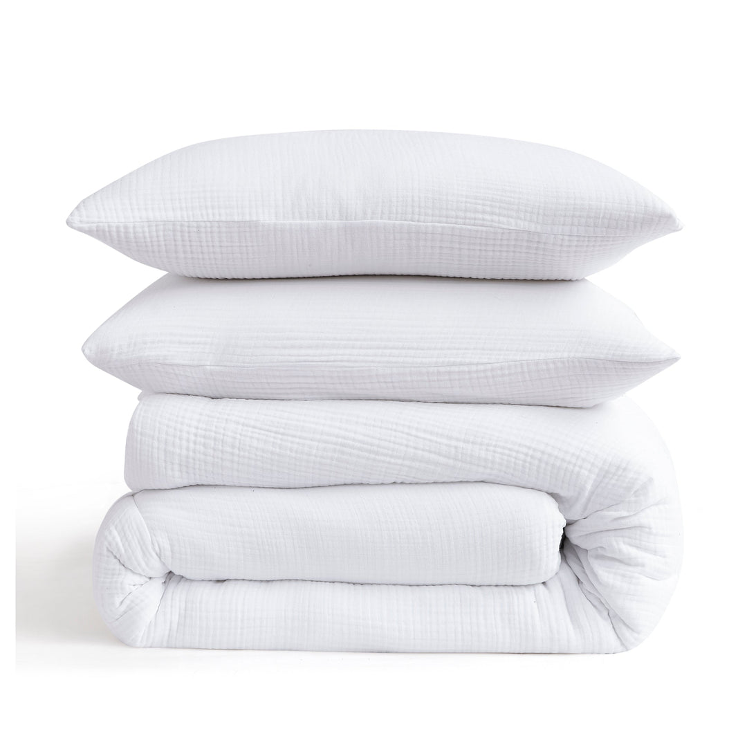 Voile cotton bedding set in white stacked with pillows