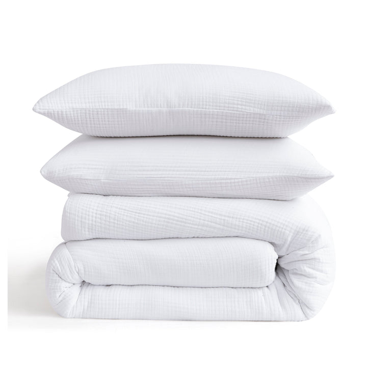 Voile cotton bedding set in white stacked with pillows