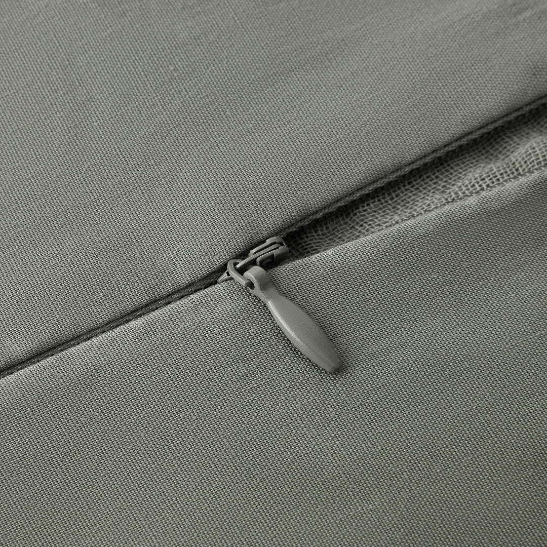 Close-up of voile cotton duvet cover zipper in sage fabric surface