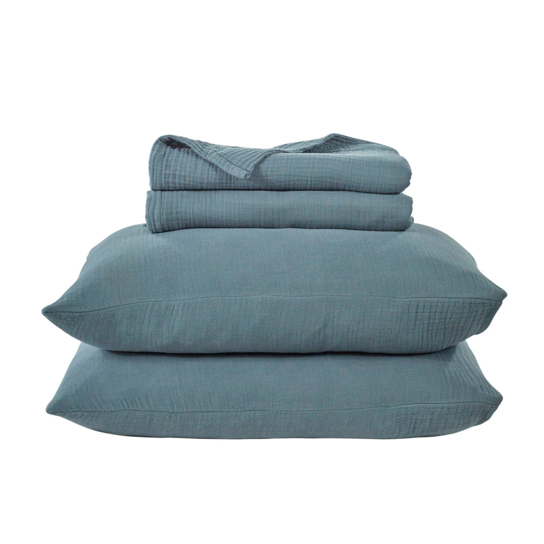 stack of storm blue voile cotton textured blanket set with 2 pillows and blanket