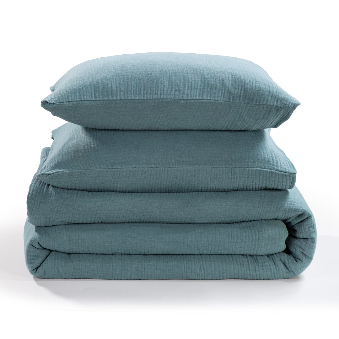 Voile cotton storm blue bedding set with a pillow and comforter on a white background