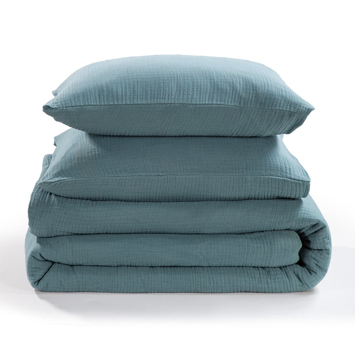 Voile cotton storm blue bedding set with a pillow and comforter on a white background